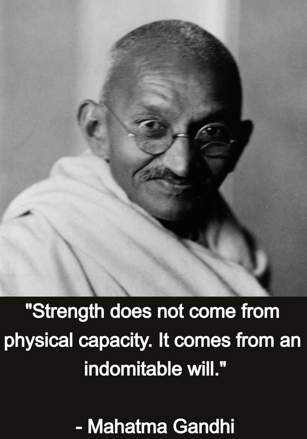 A photograph of Gandhi above the line "Strength does not come from physical capacity. It comes from an indomitable will", credited to Mahatma Gandhi. The line is from "The Doctrine of the Sword", Young India, 11 August 1920